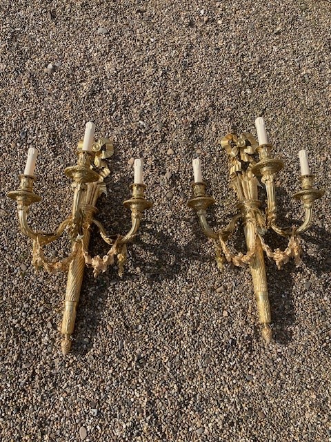 A fine and large pair of gilt bronze sconces