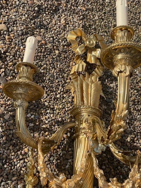 A fine and large pair of gilt bronze sconces