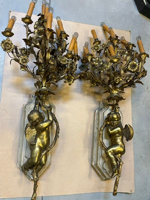 A palatial size pair of wall lights 