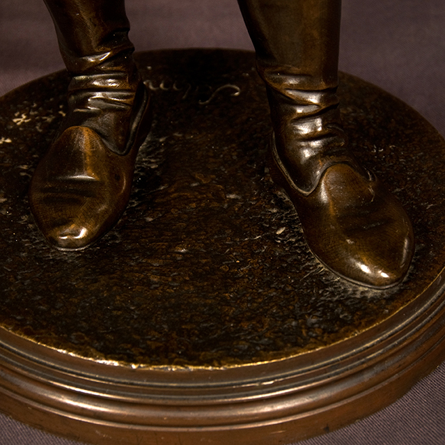 Bronze sculpture of a standing artist holding his paint palette signed Salmson