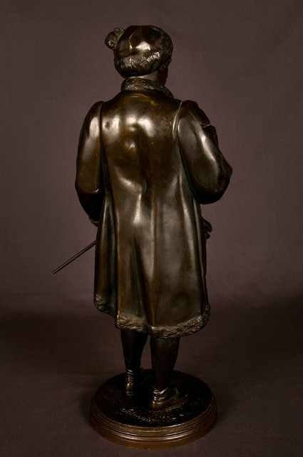 Bronze sculpture of a standing artist holding his paint palette signed Salmson