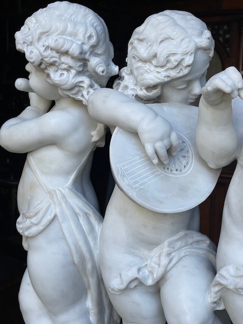 marble group depicting five putti musicians 